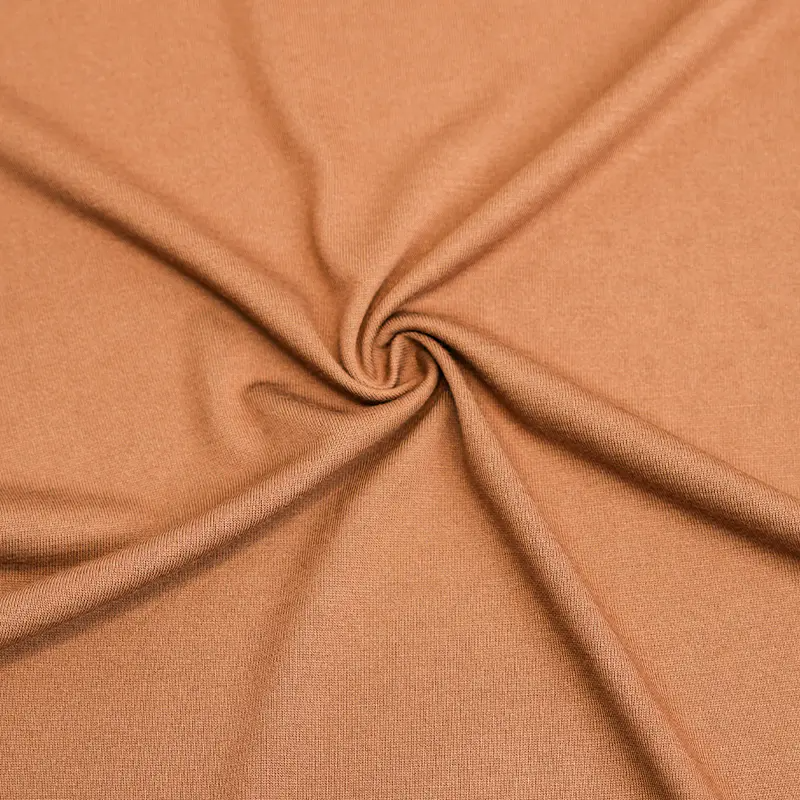 ¿Qué tela de camiseta absorbe la humedad y se seca rápidamente?
